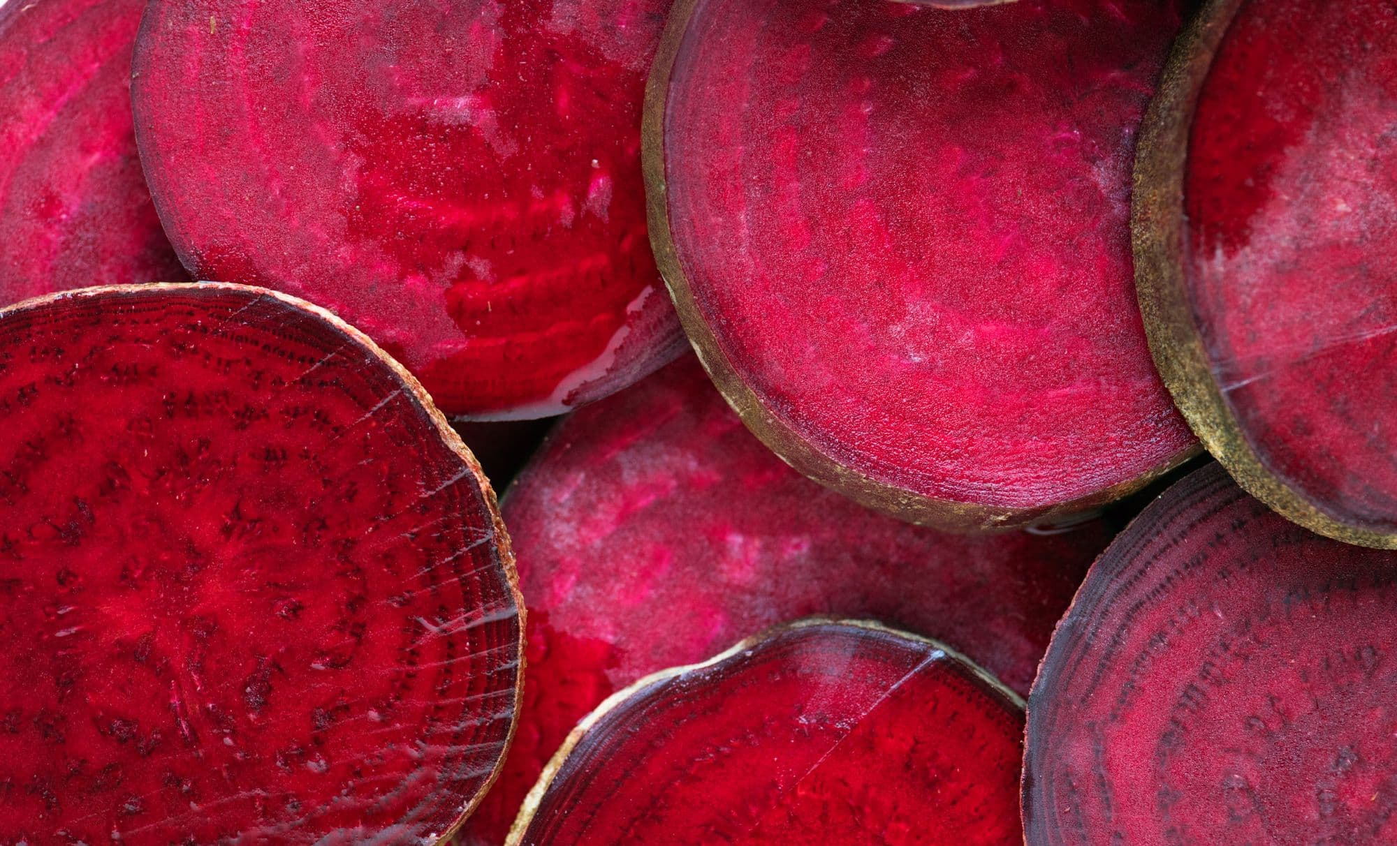 Beetroot slices close up, deep red with concentric rings