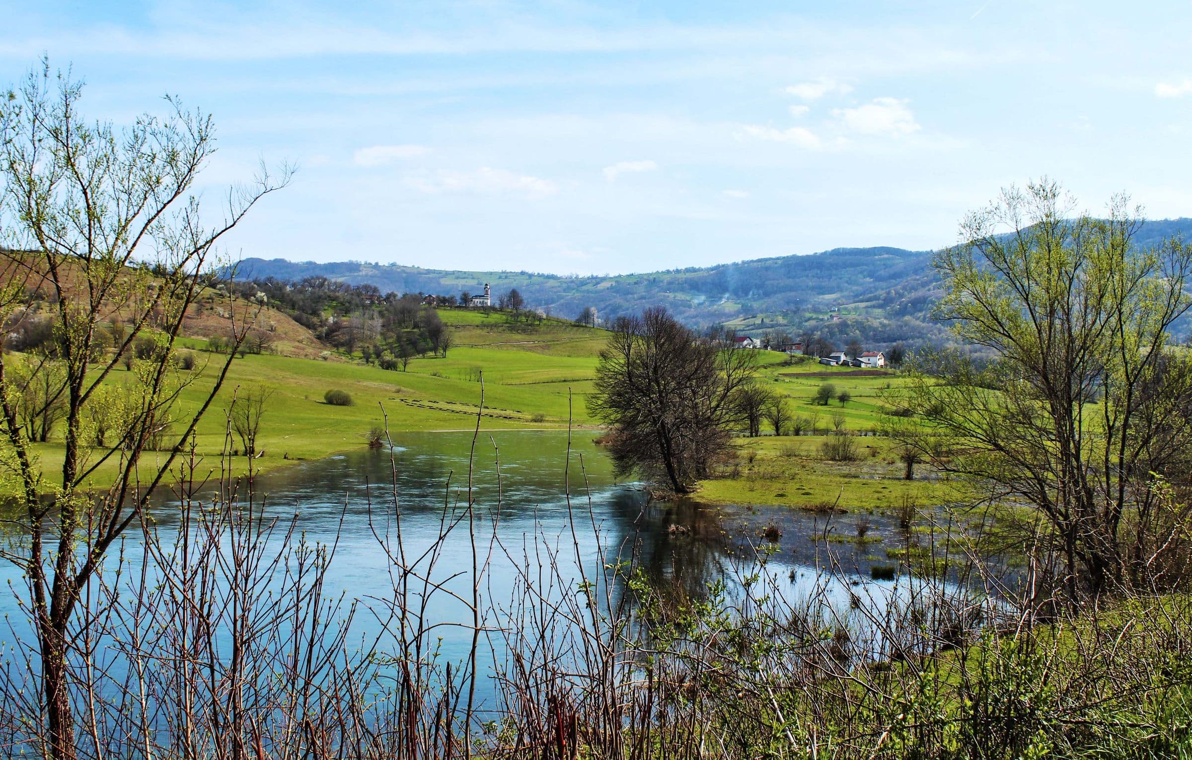 The river Pliva near Šipovo, turquoise water between green meadows and hills