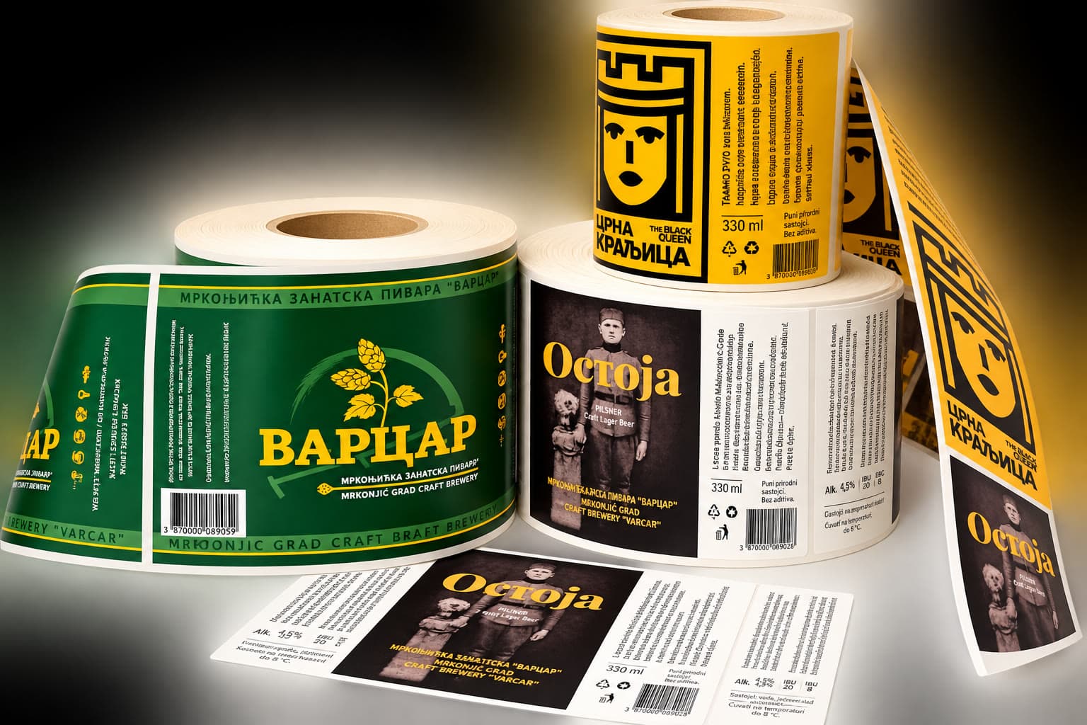 Printed label reels from the Varcar craft brewery of Mrkonjić Grad — the green Varcar label, the black Ostoja label and the yellow Crna kraljica label